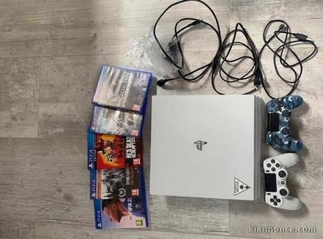 vends une ps4 pro 1To +jeux 